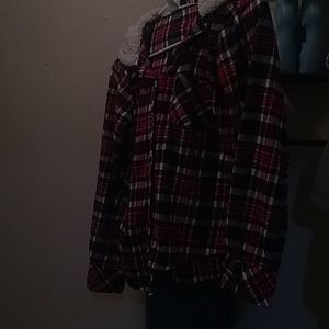 Long sleeve shirt with hoodie. It is plaid. Size M